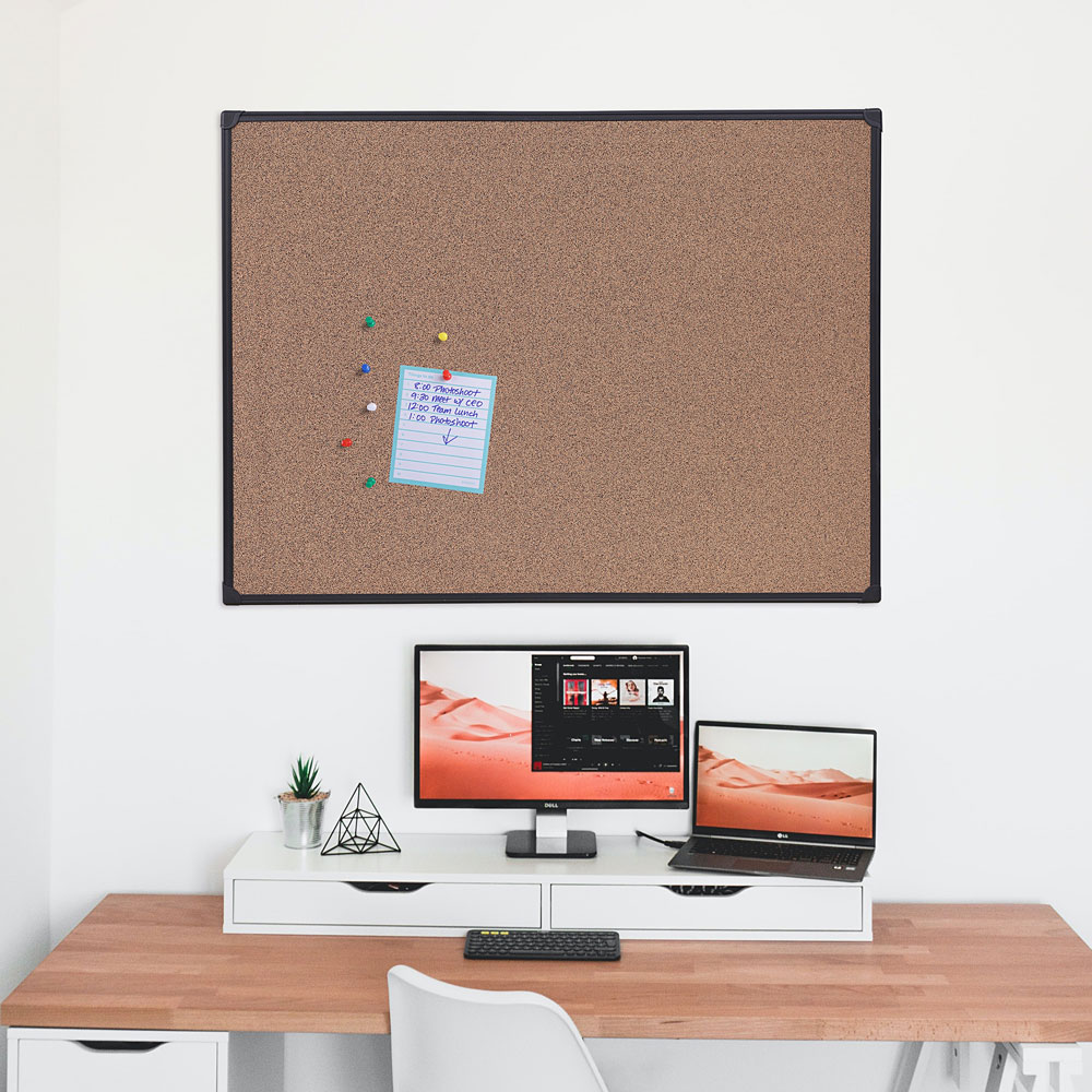 Office featuring universal cork board on the wall